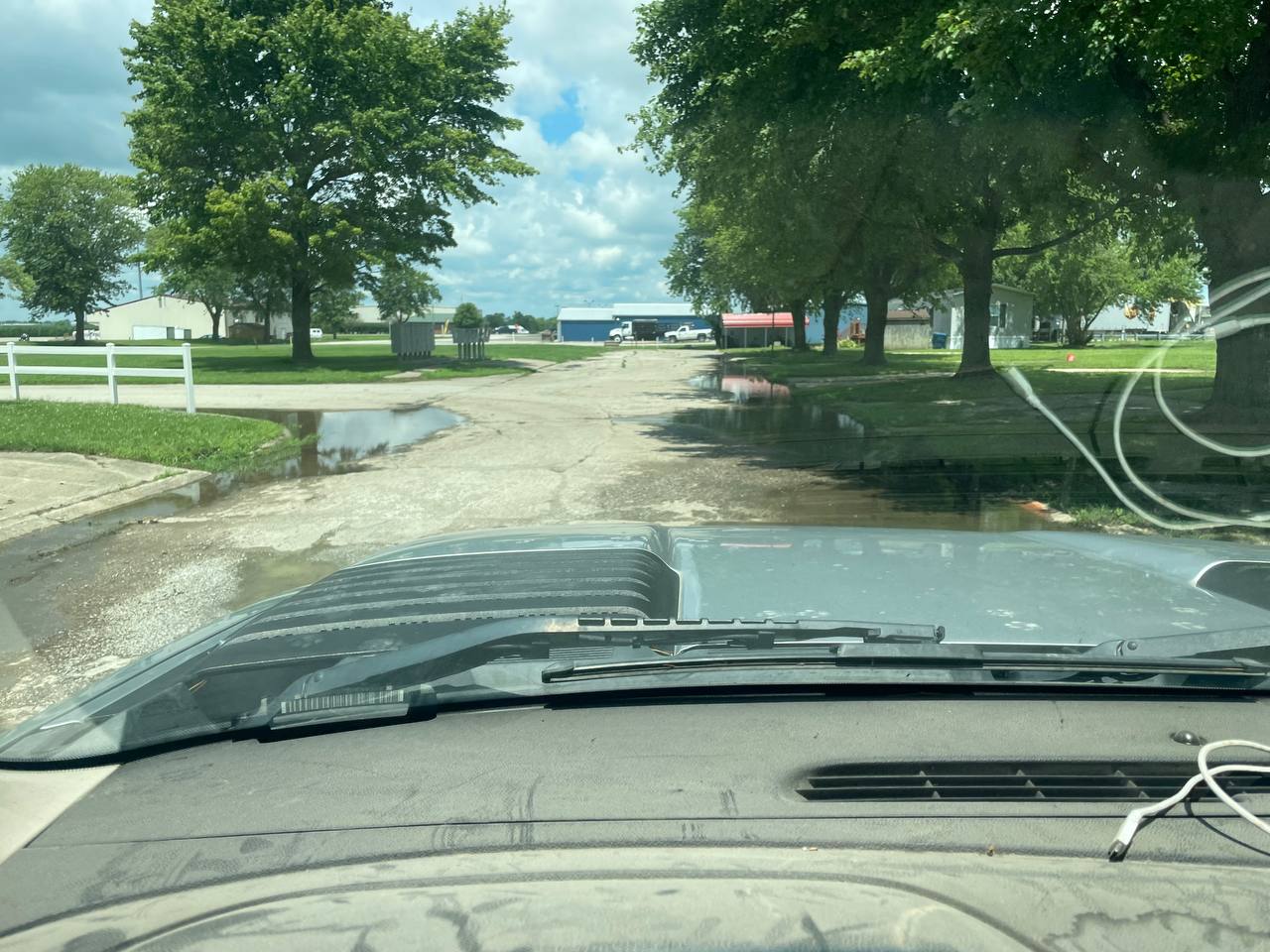 Finished rock driveway installation with weeping willow — Brohez Trucking Central Illinois